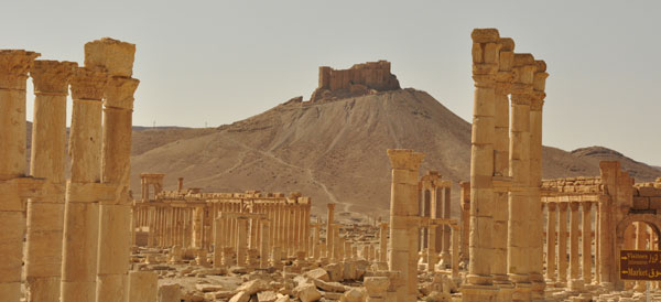 An old Arabian fort looks down on the ancient ruined city of Palymra, one of the Middle East's greatest ancient sites and sole attraction in the 'no man's' land of the Syrian desert and border with Iraq.  